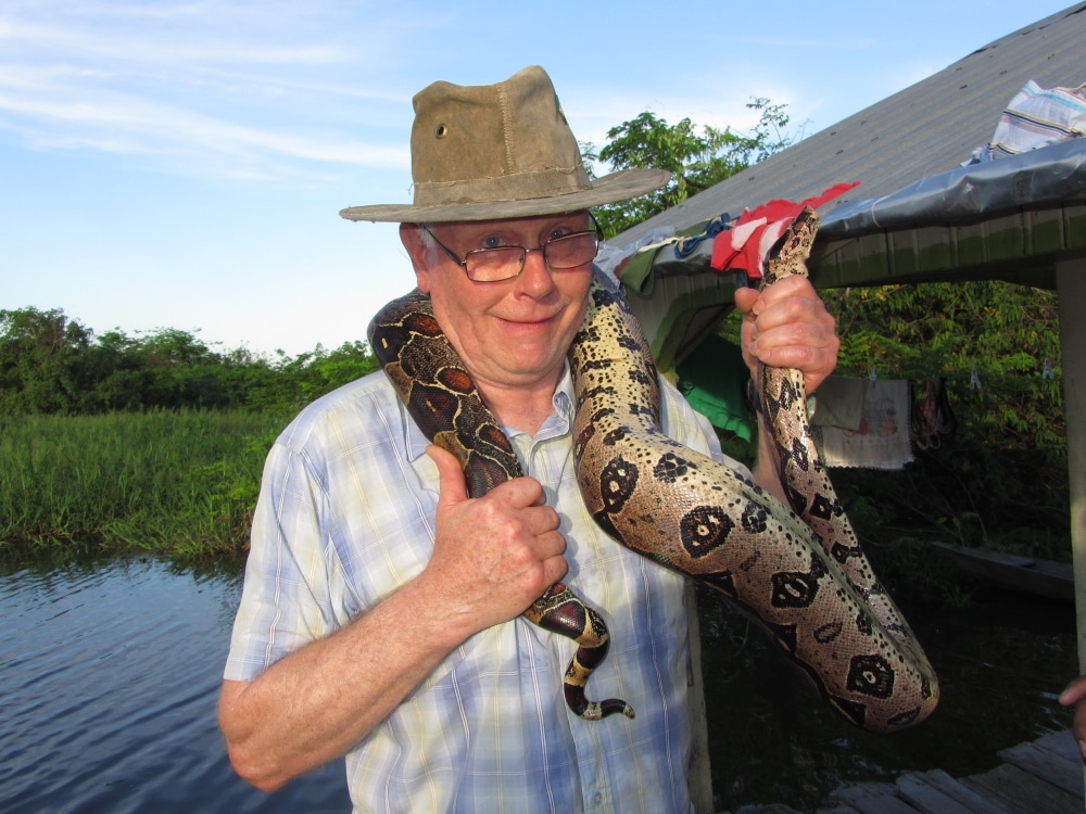 Funny guest holding Anaconda